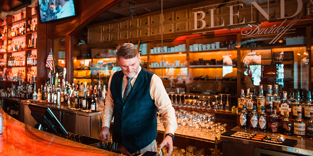 Interior View of the Davidoff Blend Bar Woodlands and a bar tender